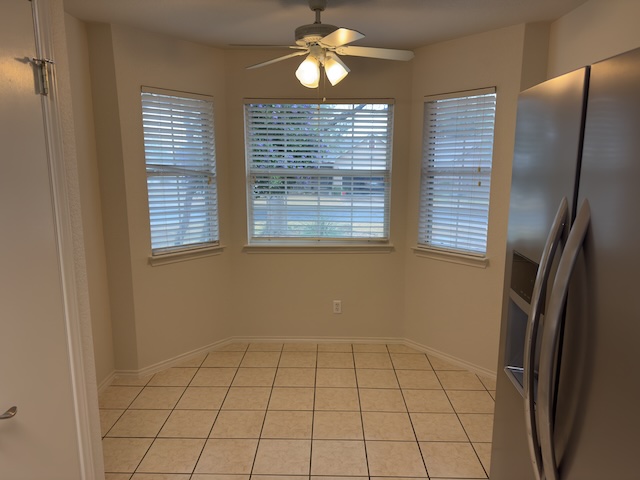 109 Plover Pass Georgetown, TX 78633 - Photo 22 of 25 Unfurnished dining area with a ceiling fan and light tile patterned floors