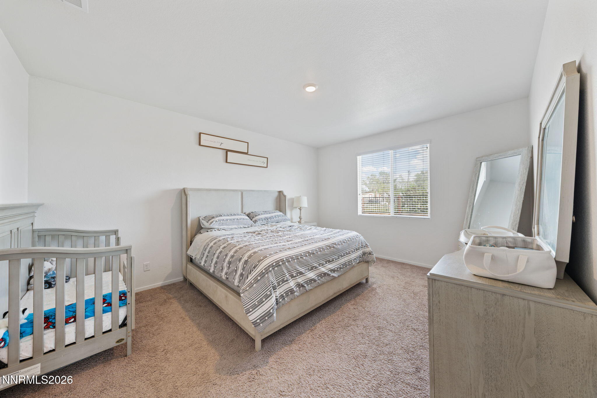 9708 Sea Glass Drive Reno, NV 89506 - Photo 16 of 51 a bedroom with a bed and a window