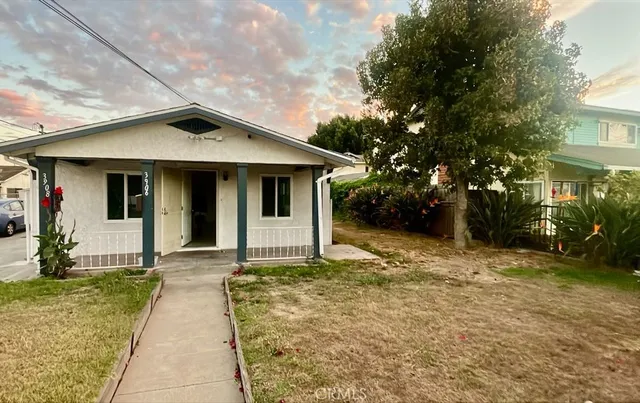 a front view of a house with yard