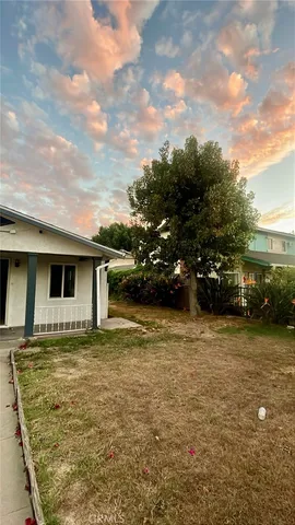 a view of a house with a yard
