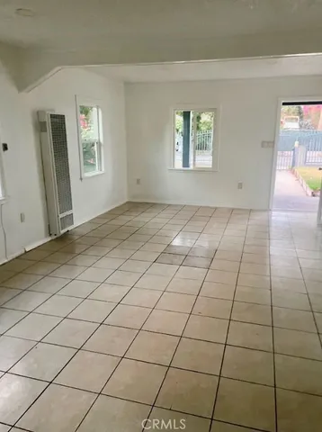 a view of a livingroom and window