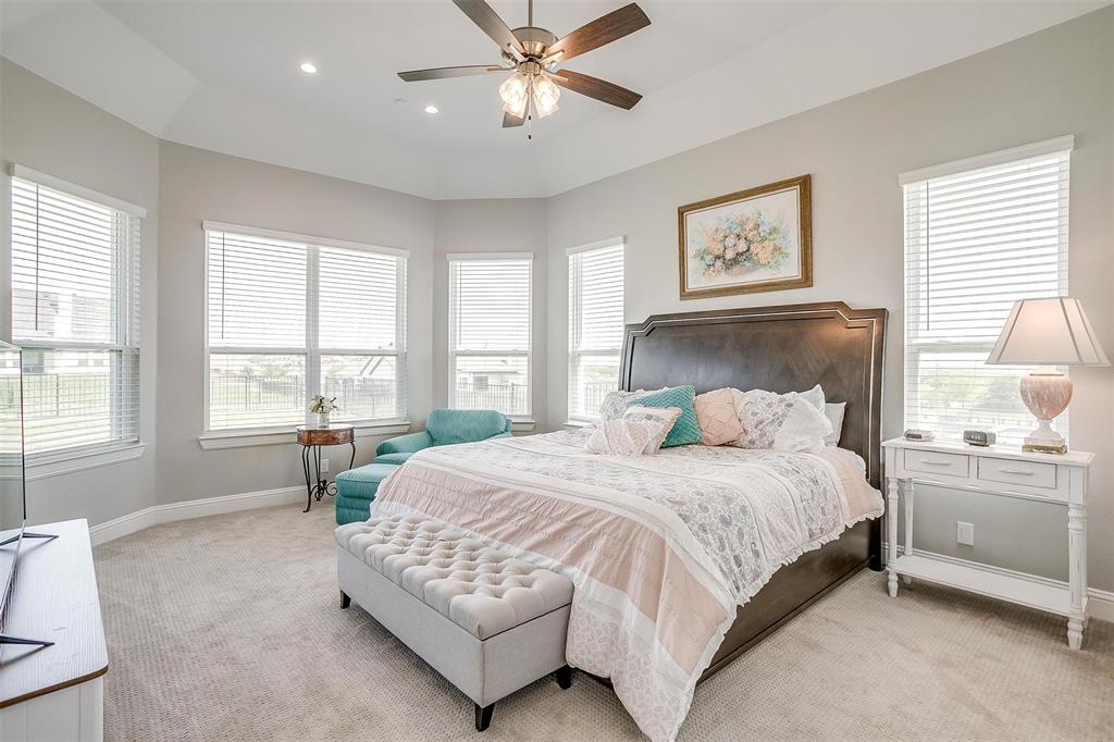 7730 Barber Rnch Road Fort Worth, TX 76126 - Photo 16 of 19 Spacious room featuring a tray ceiling, recessed lighting, and a ceiling fan with light fixture