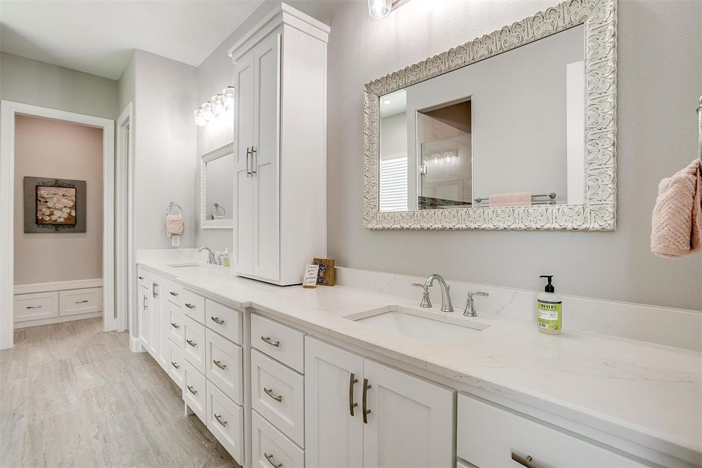 7730 Barber Rnch Road Fort Worth, TX 76126 - Photo 17 of 19 Dual vanity with white cabinetry, light-colored countertops, and undermount sinks