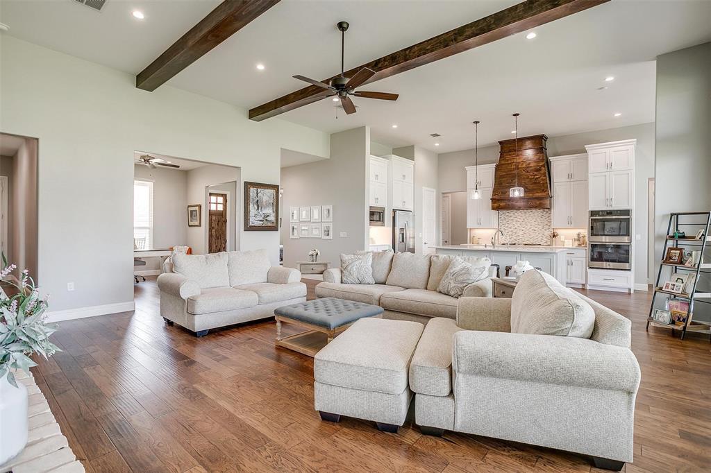 7730 Barber Rnch Road Fort Worth, TX 76126 - Photo 8 of 19 Spacious living area featuring wood-finish flooring, vaulted ceilings with exposed wood beams, and recessed lighting