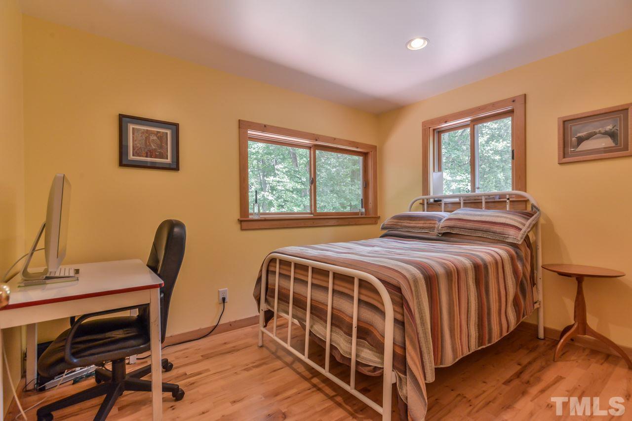 8710 Morrow Mill Road Mebane, NC 27302 - Photo 15 of 24 Third bedroom is on second level. Currently and previously used as a home office / study or walk-in closet / changing room for those with collections that need some extra space.