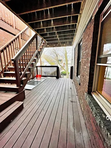 a view of deck with wooden floor and staircase