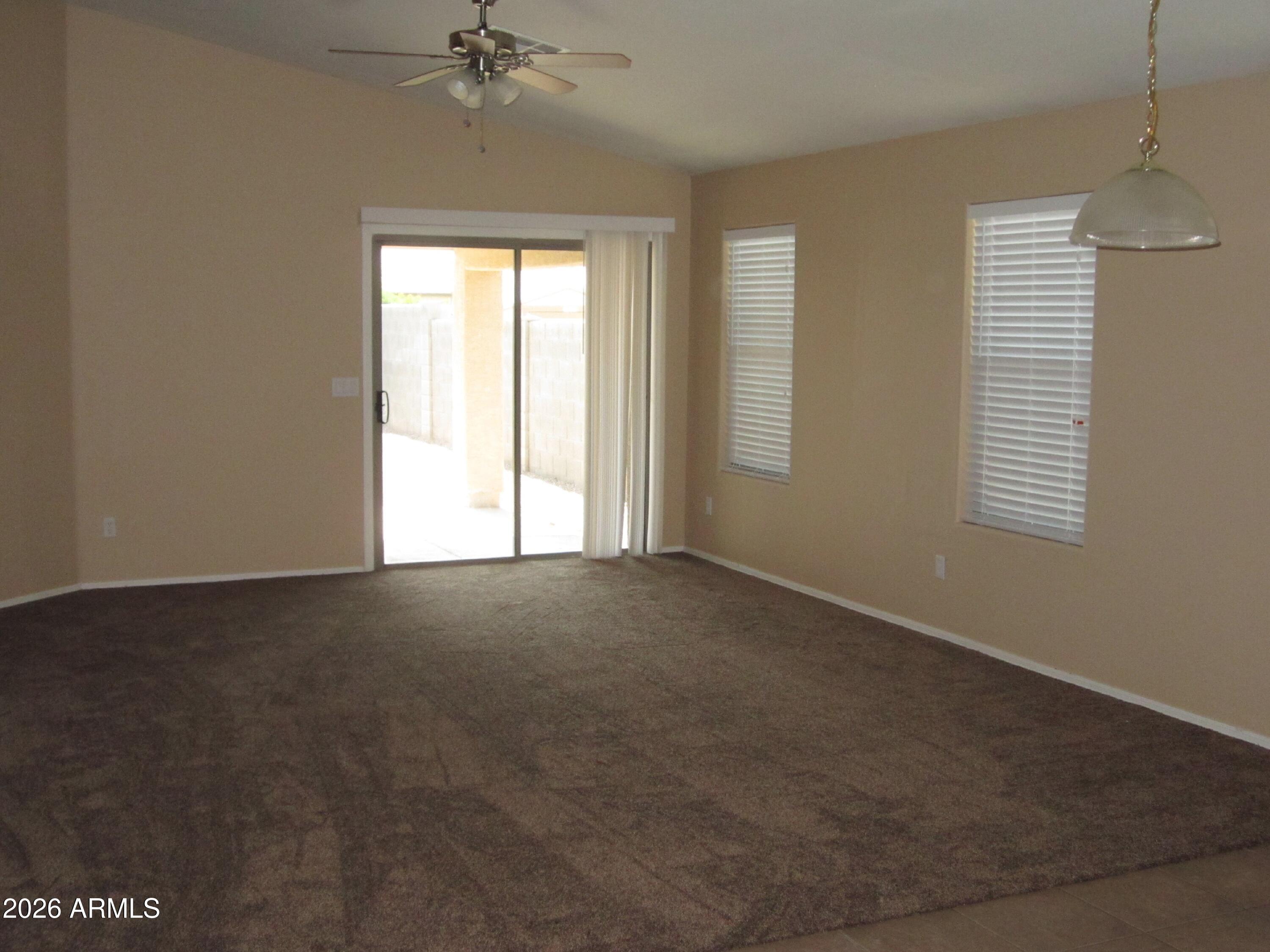 18671 North Madison Road Maricopa, AZ 85139 - Photo 11 of 27 a view of an empty room with a window