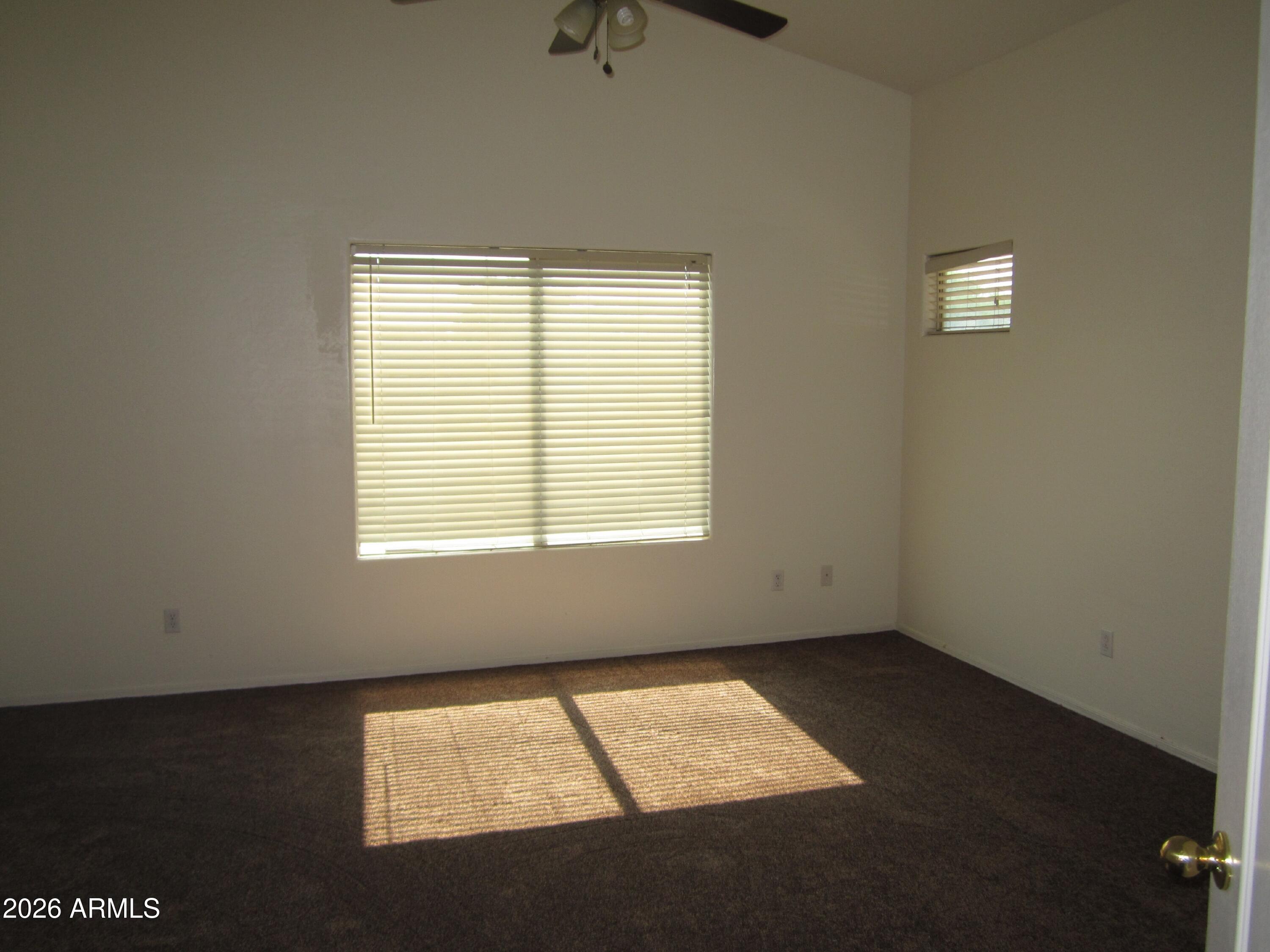 18671 North Madison Road Maricopa, AZ 85139 - Photo 16 of 27 a view of an empty room with a window