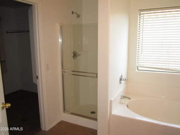 a bathroom with a shower and a sink