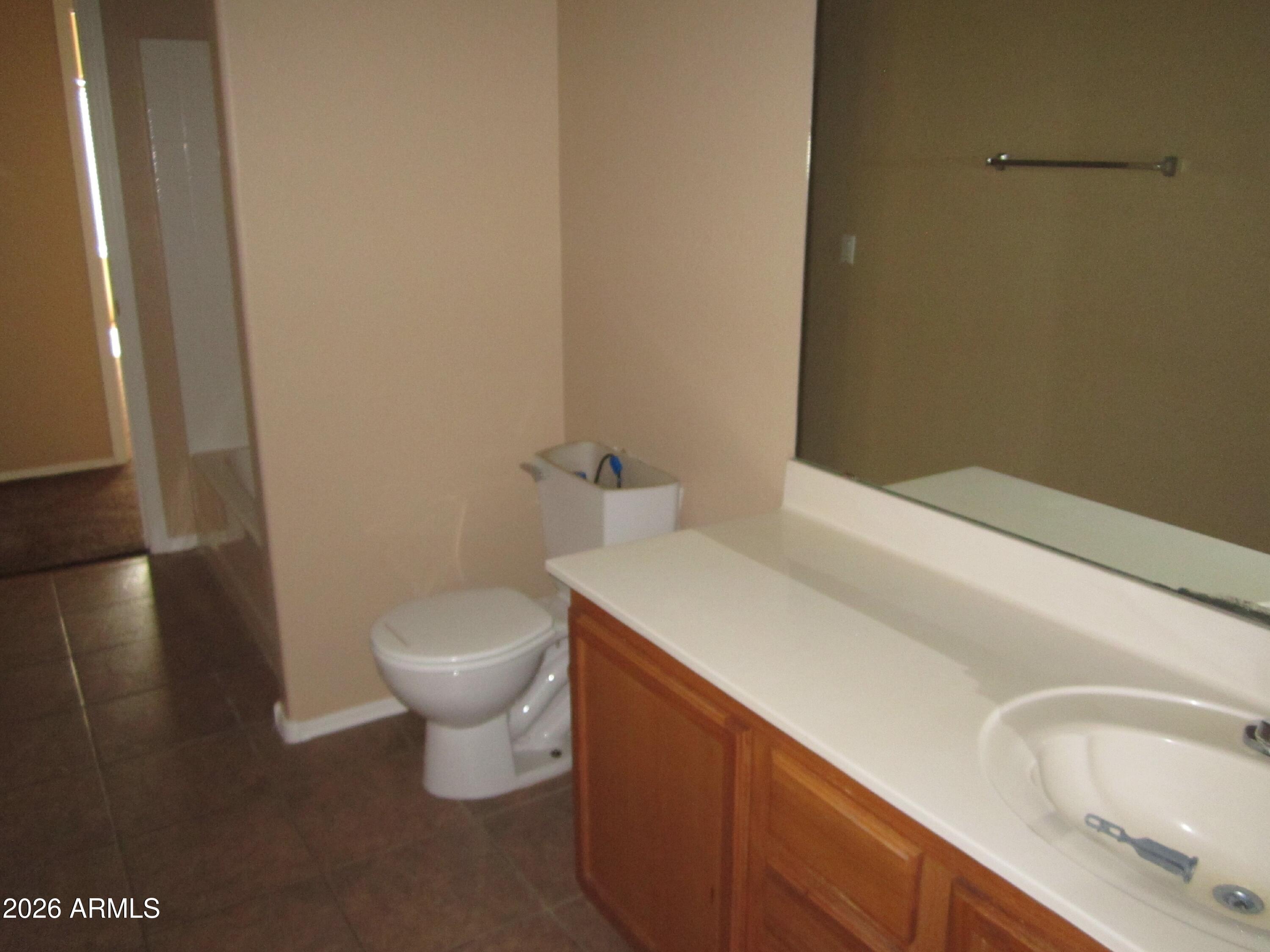 18671 North Madison Road Maricopa, AZ 85139 - Photo 20 of 27 a bathroom with a sink and a toilet