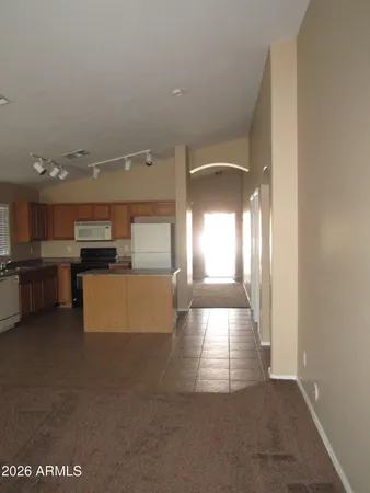 a kitchen with stainless steel appliances granite countertop cabinets and refrigerator