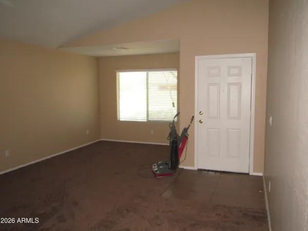 a view of an empty room with a window