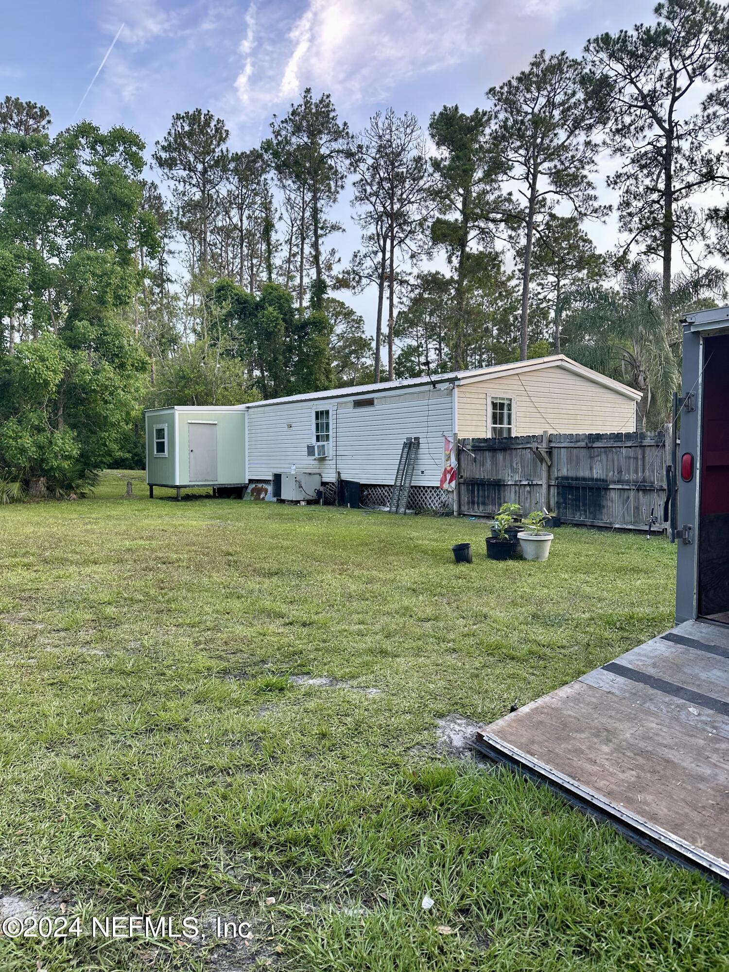 3140 Green Acres Road St. Augustine, FL 32084 - Photo 12 of 15 a view of a house with a yard and sitting area