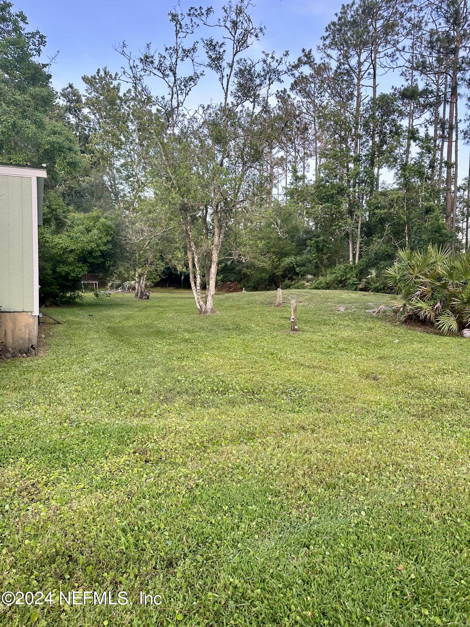3140 Green Acres Road St. Augustine, FL 32084 - Photo 13 of 15 a view of field with trees in background
