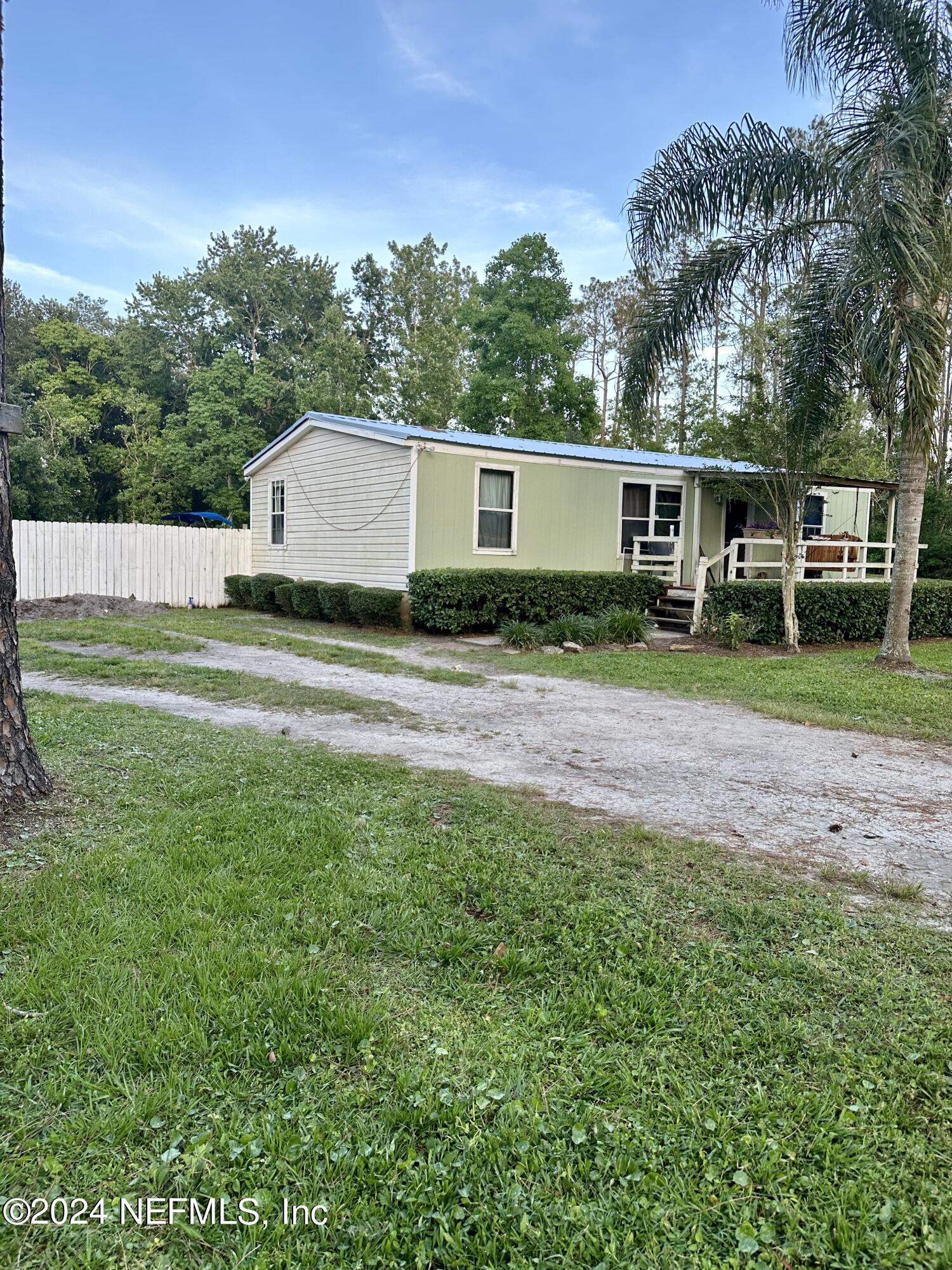 3140 Green Acres Road St. Augustine, FL 32084 - Photo 2 of 15 a view of a backyard of the house