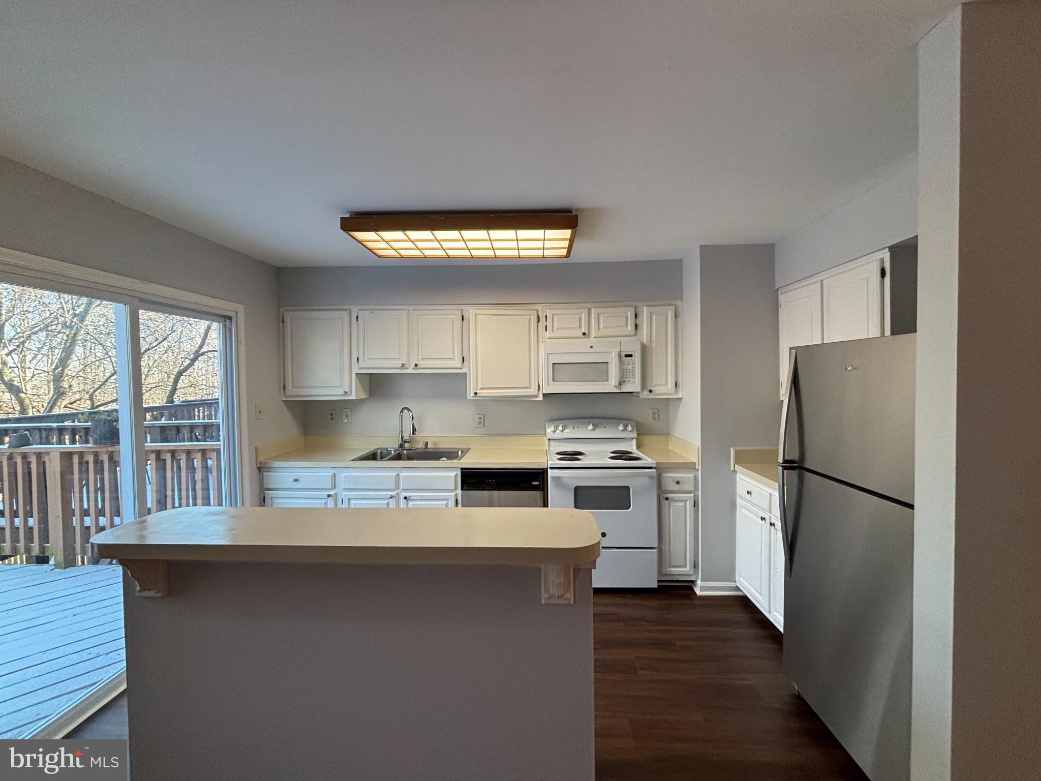 2718 Hunters Gate Terrace Silver Spring, MD 20904 - Photo 8 of 28 Open Kitchen with sliding doors to deck