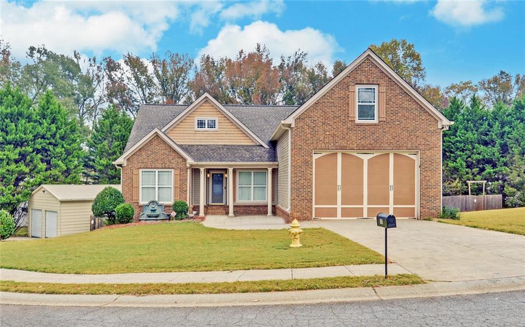 131 Hampton Drive Jefferson, GA 30549 - Photo 1 of 1 a front view of a house with a yard and garage