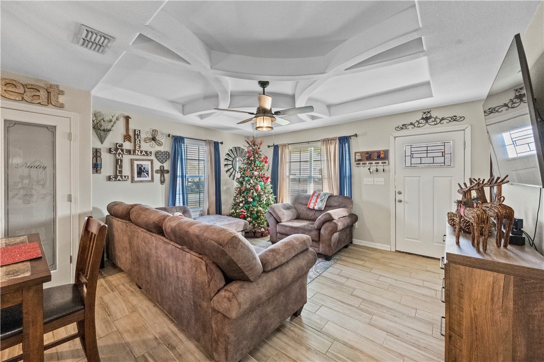 200 West 4th Street Alice, TX 78332 - Photo 5 of 19 a living room with furniture and wooden floor