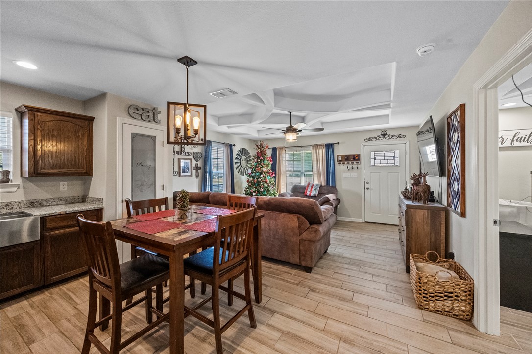 200 West 4th Street Alice, TX 78332 - Photo 6 of 19 a view of a dining room with furniture window and wooden floor