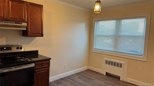 a kitchen with a stove and a microwave