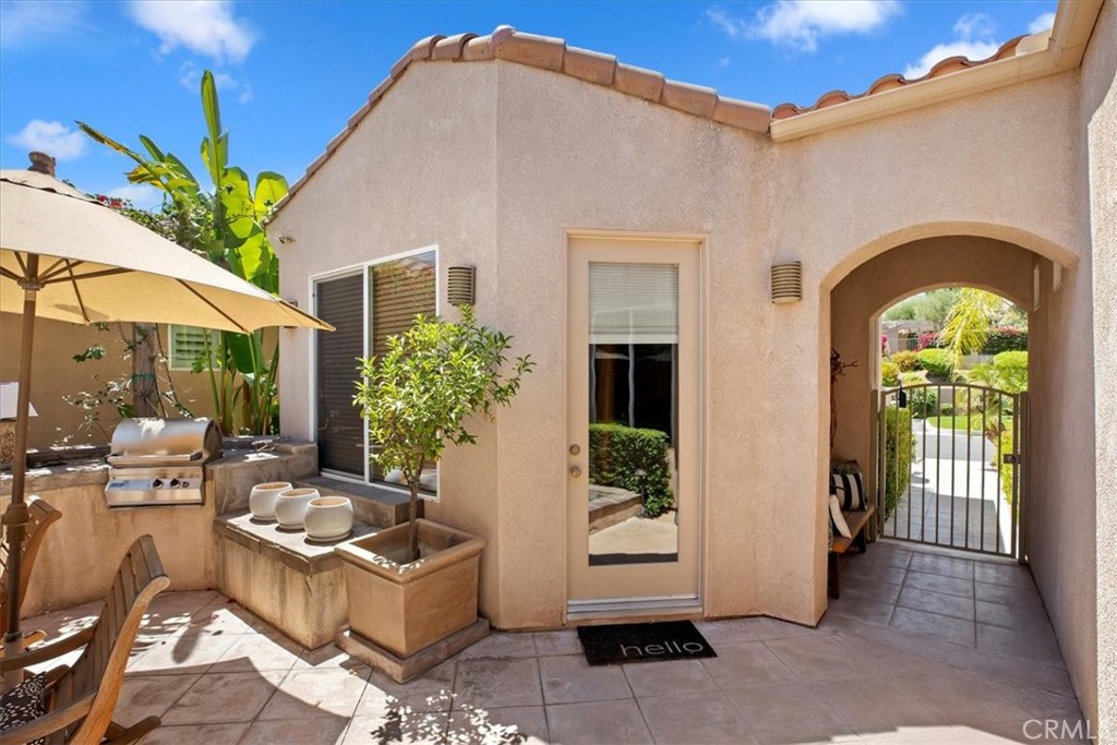5614 Queen Palms Drive Riverside, CA 92506 - Photo 11 of 50 a front view of house with yard outdoor seating and barbeque oven