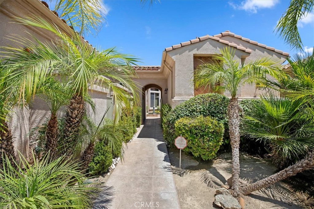5614 Queen Palms Drive Riverside, CA 92506 - Photo 2 of 50 a front view of a house with garden
