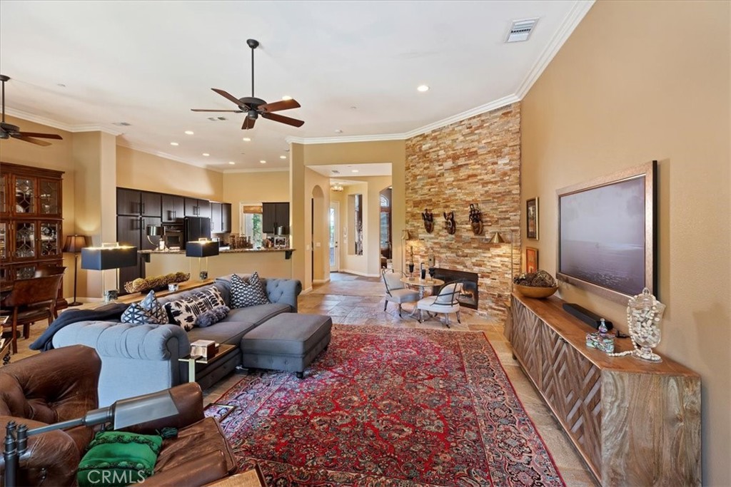 5614 Queen Palms Drive Riverside, CA 92506 - Photo 23 of 50 a living room with furniture wooden floor and a flat screen tv