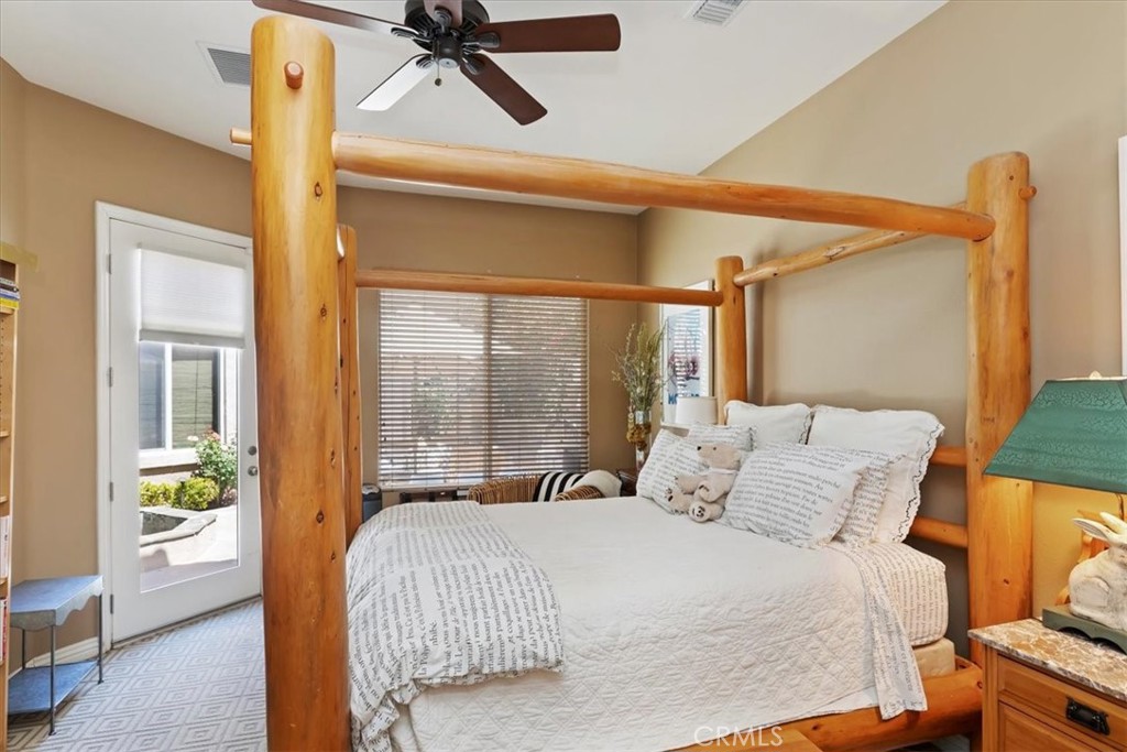 5614 Queen Palms Drive Riverside, CA 92506 - Photo 44 of 50 a bedroom with a bed and a large window