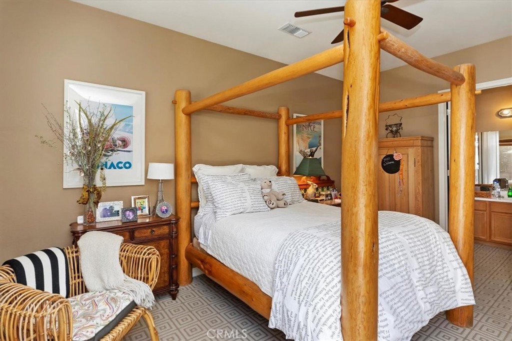 5614 Queen Palms Drive Riverside, CA 92506 - Photo 45 of 50 a bedroom with a bed and wooden floor