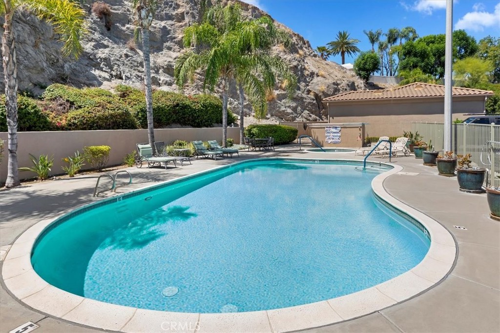 5614 Queen Palms Drive Riverside, CA 92506 - Photo 50 of 50 a view of a swimming pool with outdoor seating