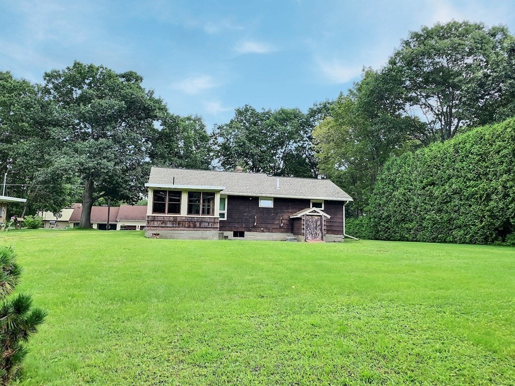 330 Hollis Road Lunenburg, MA 01462 - Photo 4 of 22 a view of a house with backyard sitting area and garden