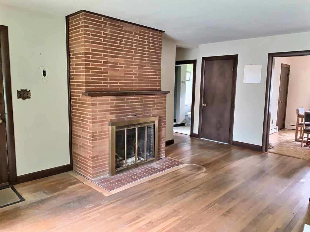 330 Hollis Road Lunenburg, MA 01462 - Photo 7 of 22 a view of a livingroom with a fireplace