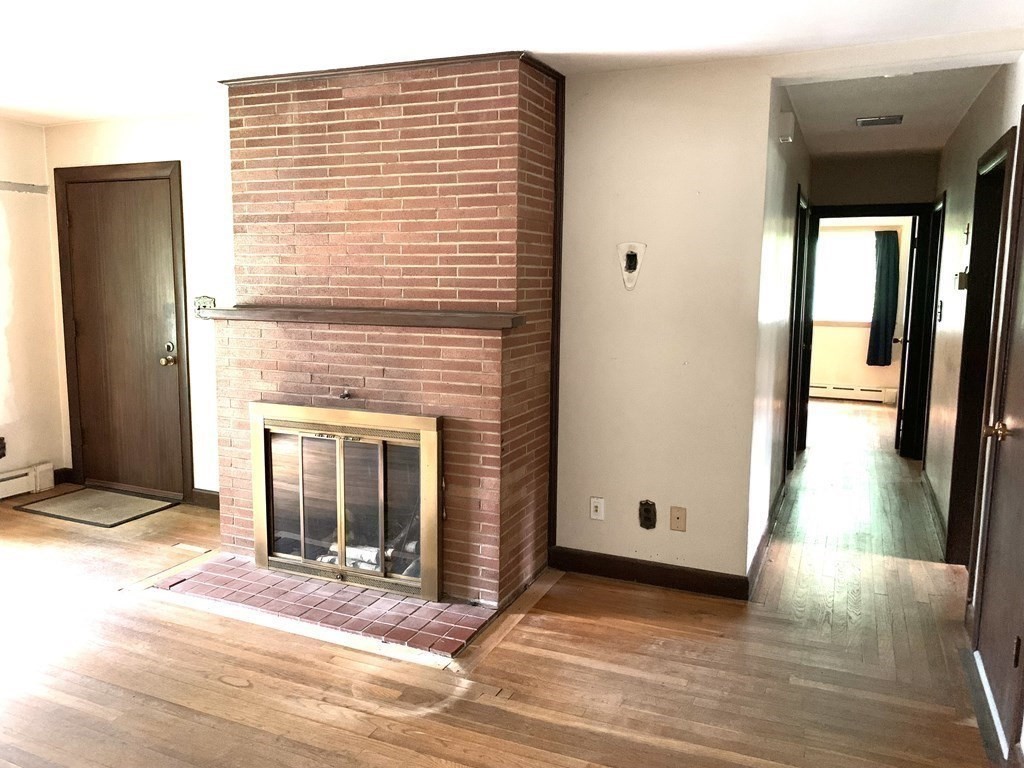 330 Hollis Road Lunenburg, MA 01462 - Photo 8 of 22 a view of a house with a door and wooden floor