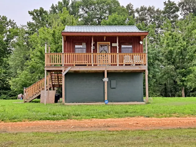 a view of a porch with wooden floor