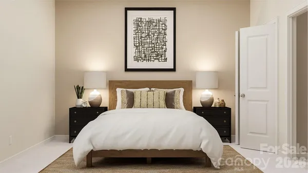 a bedroom with a bed and a night stand