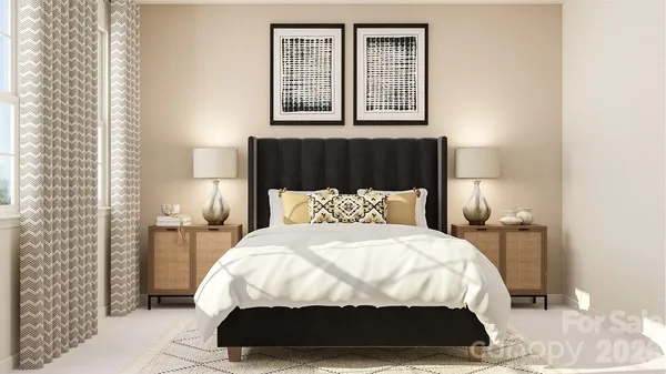 a bedroom with a bed and a night stand