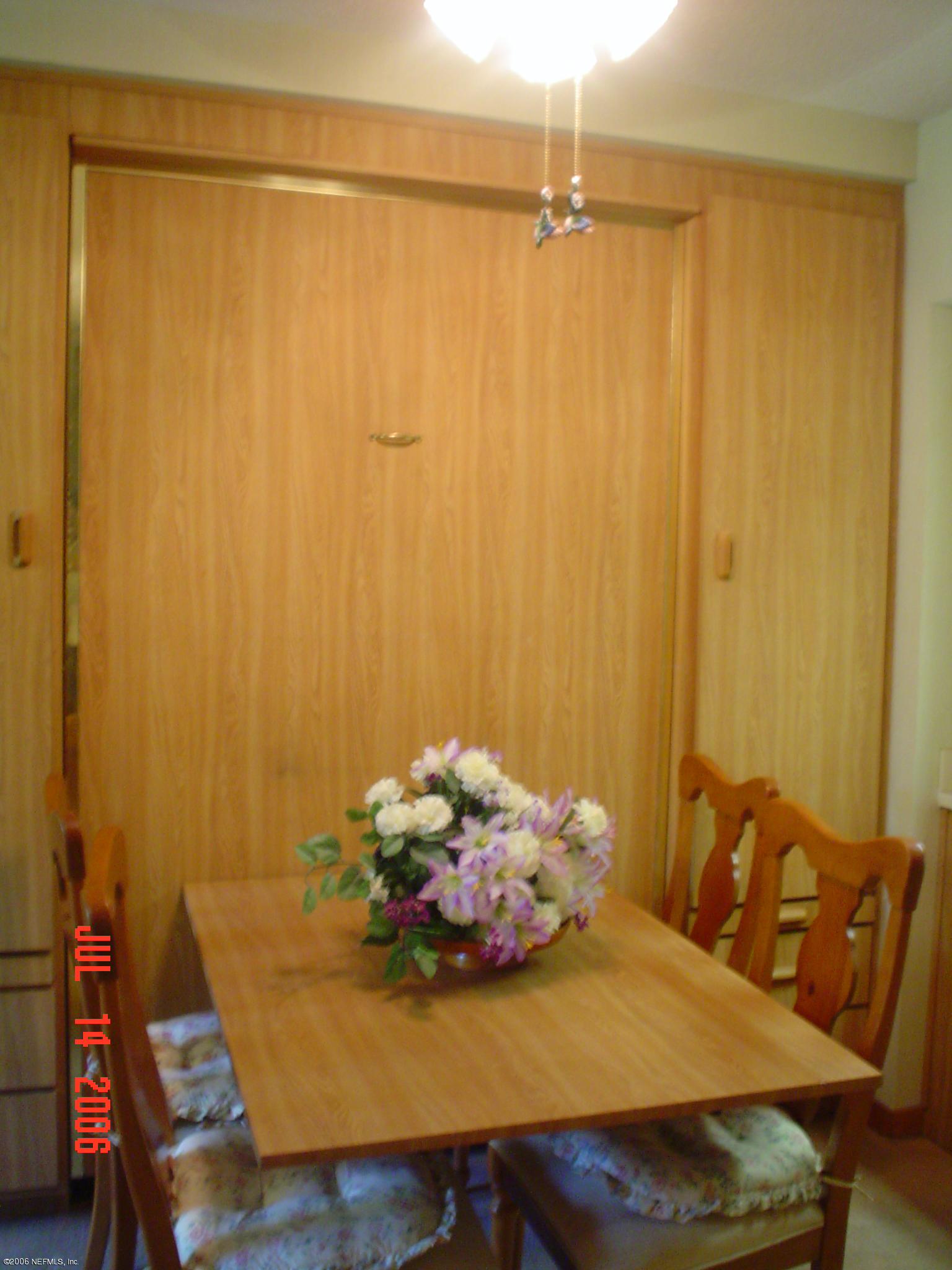 2910 Ravines Road Middleburg, FL 32068 - Photo 2 of 2 dining table and hide a bed