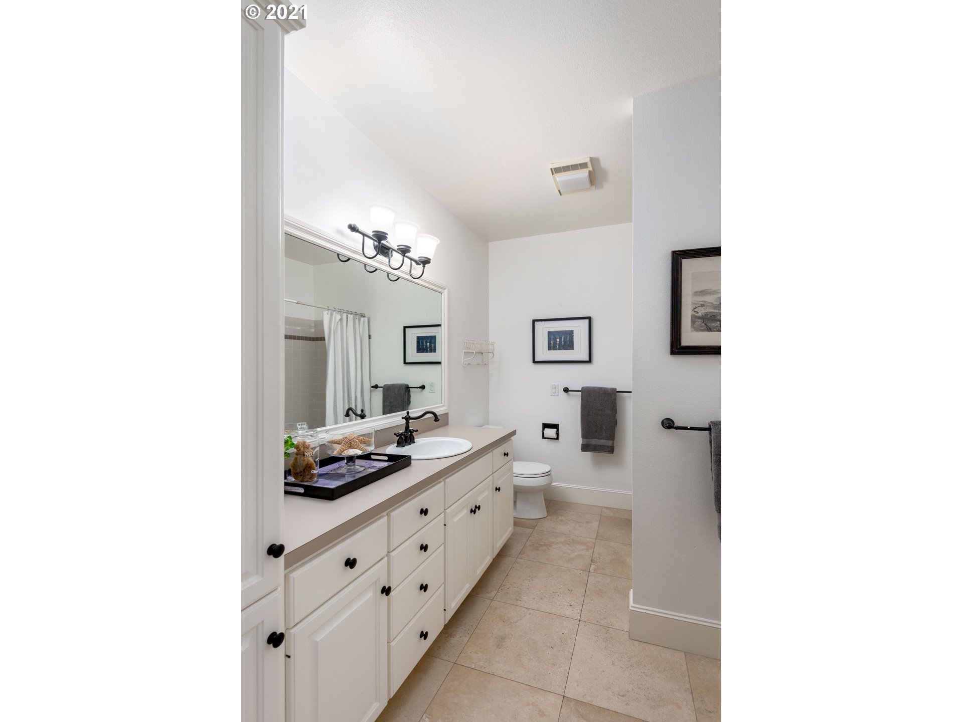 1703 Victorian Way Eugene, OR 97401 - Photo 17 of 32 a kitchen with granite countertop a sink and cabinets