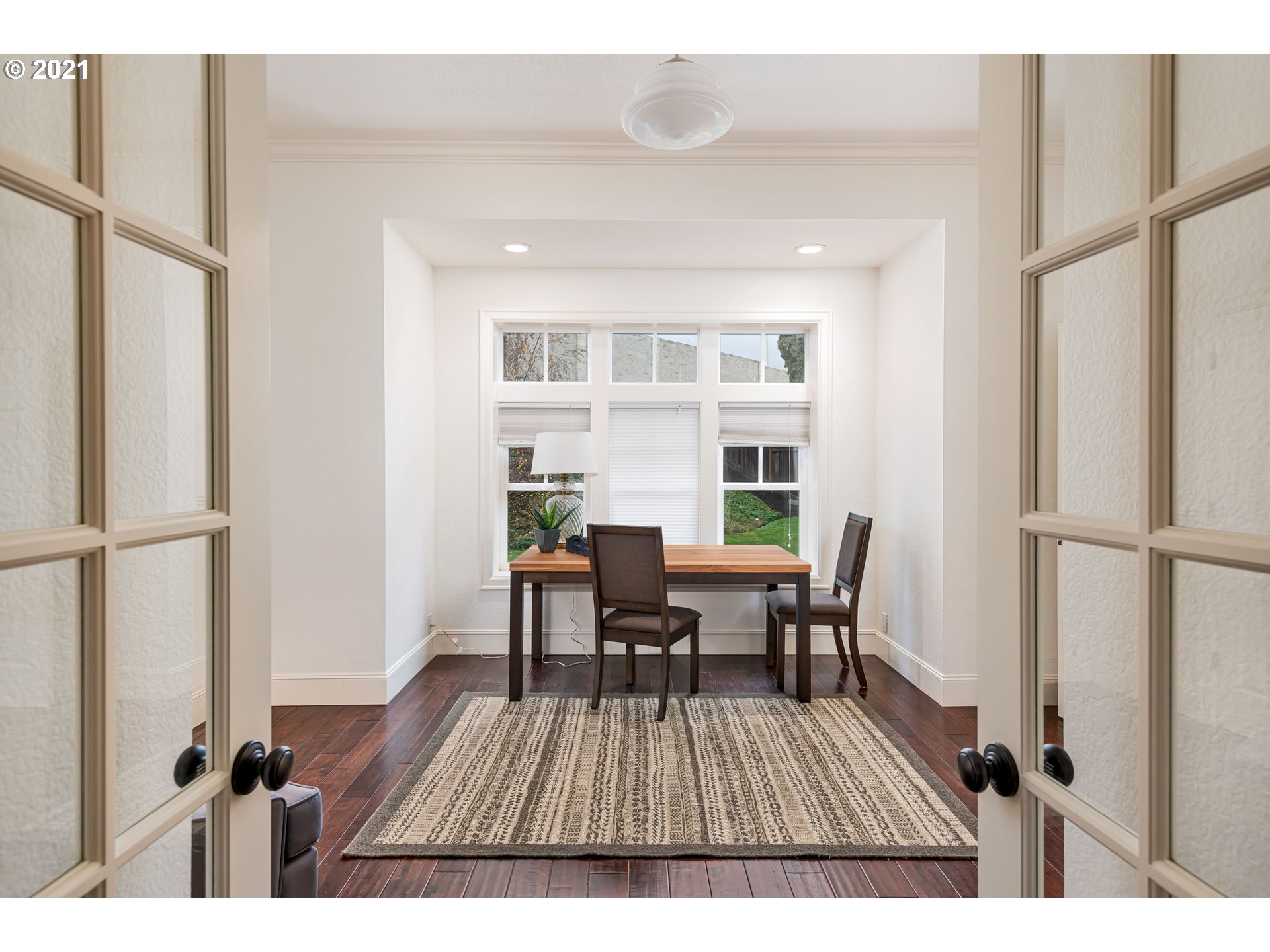 1703 Victorian Way Eugene, OR 97401 - Photo 18 of 32 a view of a dining room with furniture window and wooden floor
