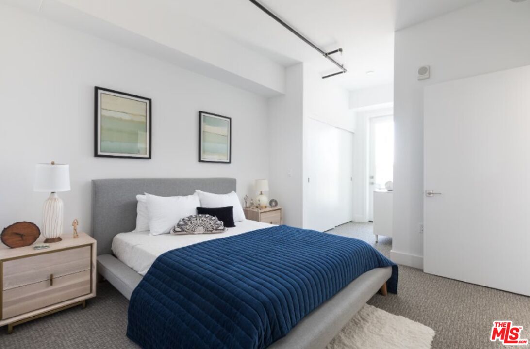 4210 Del Rey Avenue, Unit 501 Marina del Rey, CA 90292 - Photo 3 of 10 a bedroom with a bed and a window