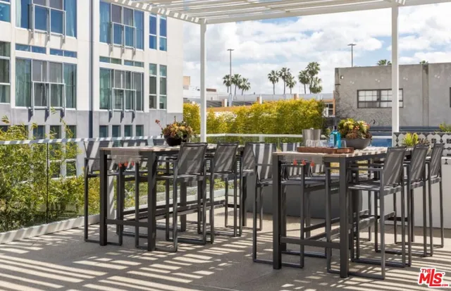 a view of a balcony with chairs