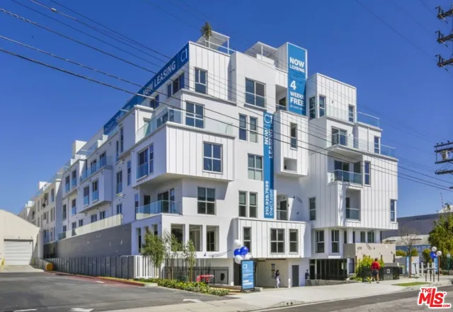 a front view of a building with street view