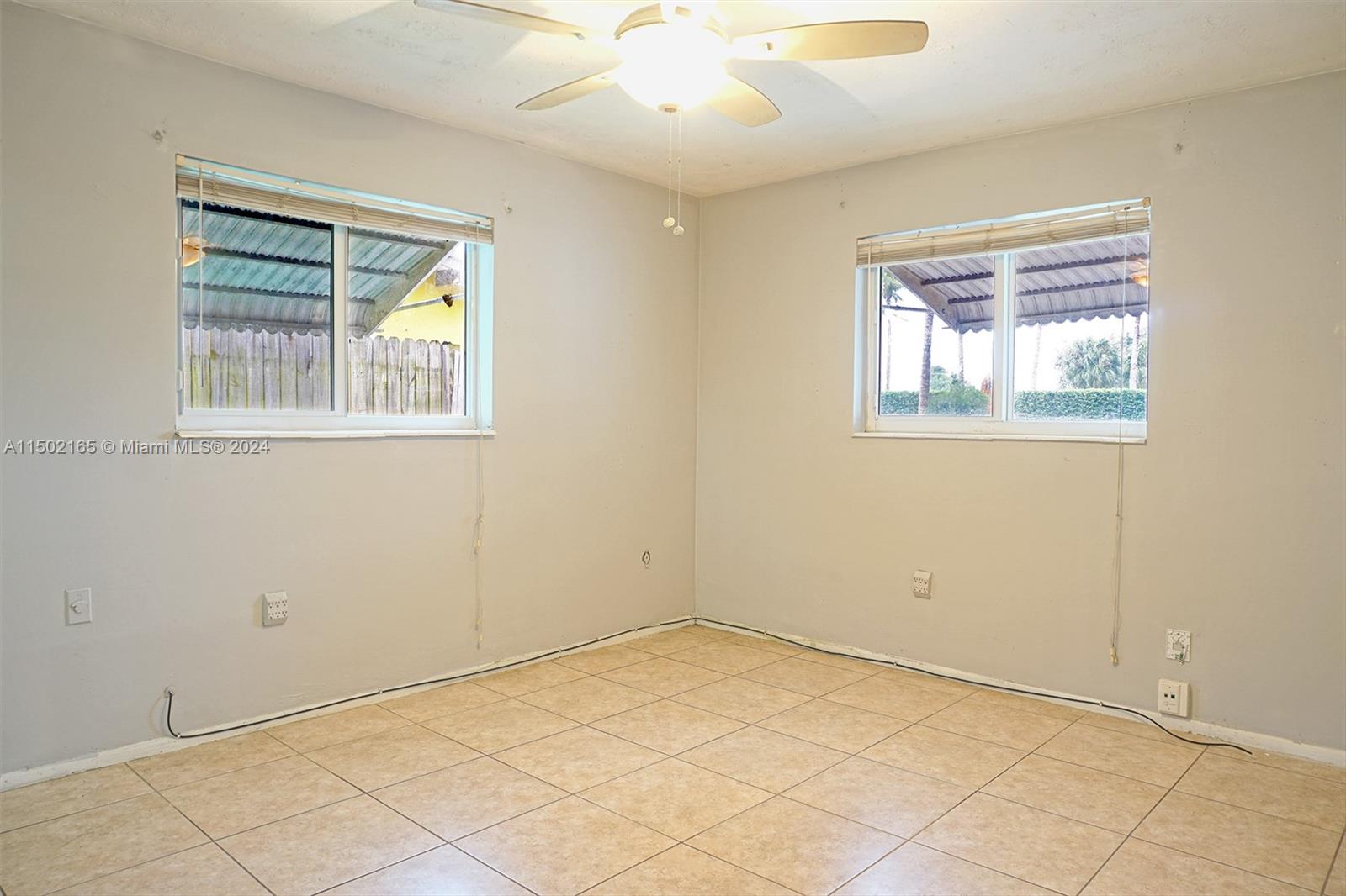 2496 North Pine Island Road Sunrise, FL 33322 - Photo 12 of 15 an empty room with windows