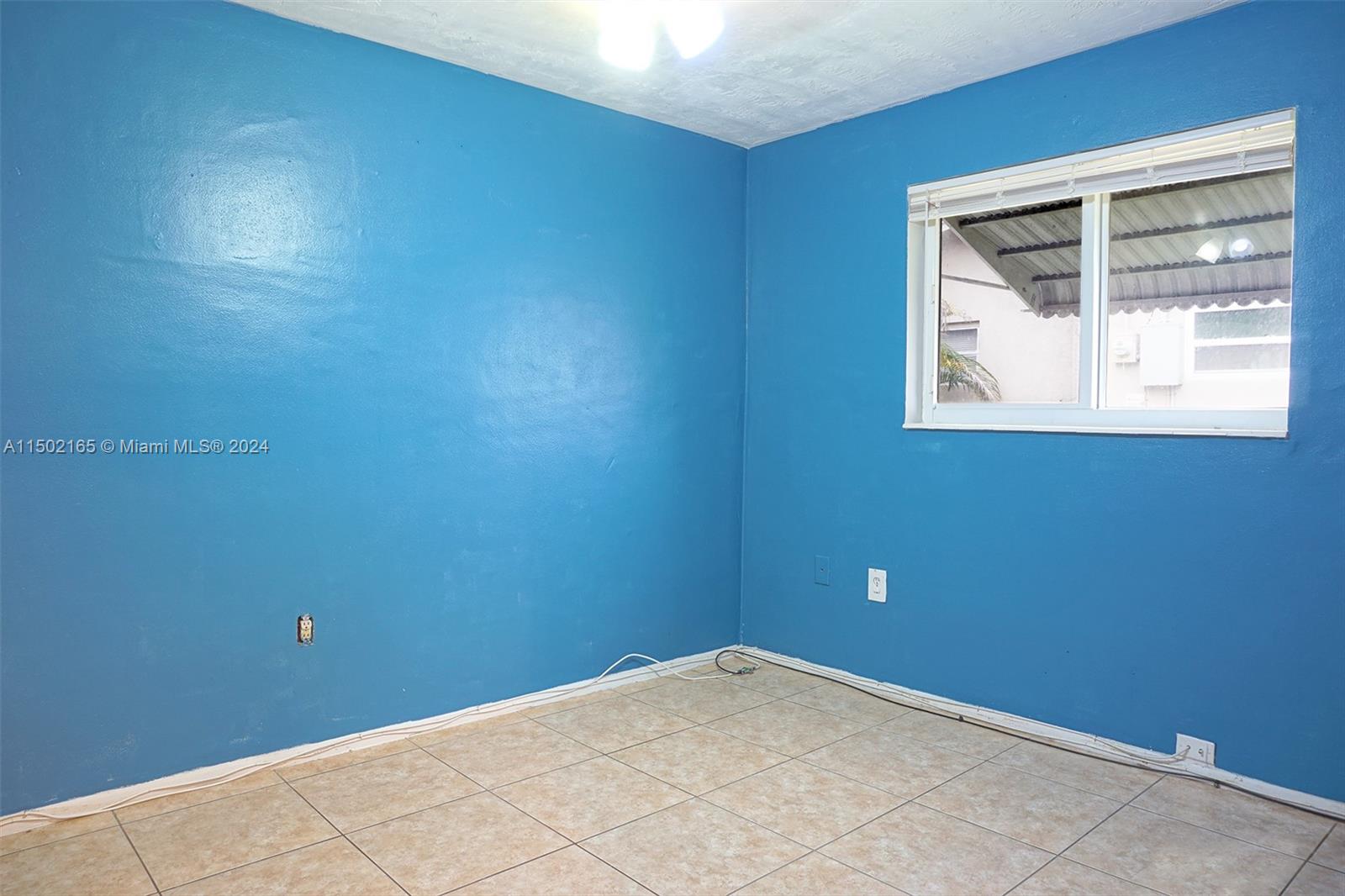 2496 North Pine Island Road Sunrise, FL 33322 - Photo 14 of 15 a view of a small space with a window