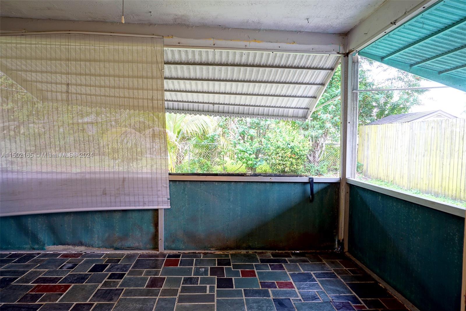 2496 North Pine Island Road Sunrise, FL 33322 - Photo 15 of 15 a view of a brick wall with a window
