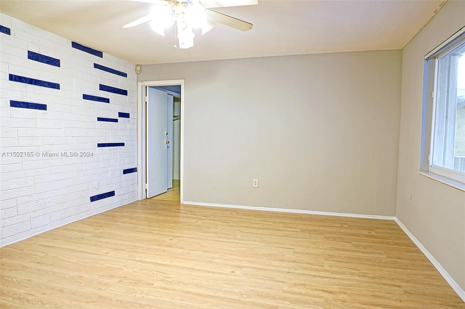 2496 North Pine Island Road Sunrise, FL 33322 - Photo 3 of 15 a view of an empty room with a window