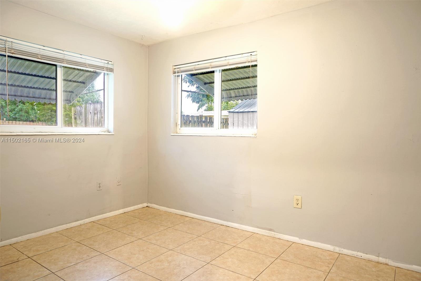 2496 North Pine Island Road Sunrise, FL 33322 - Photo 9 of 15 an empty room with a window
