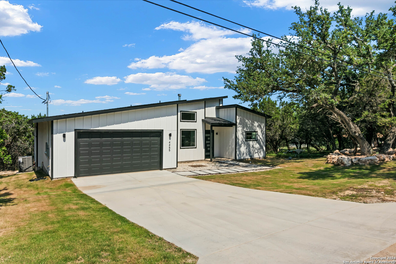 a view of a house with pool and porch
