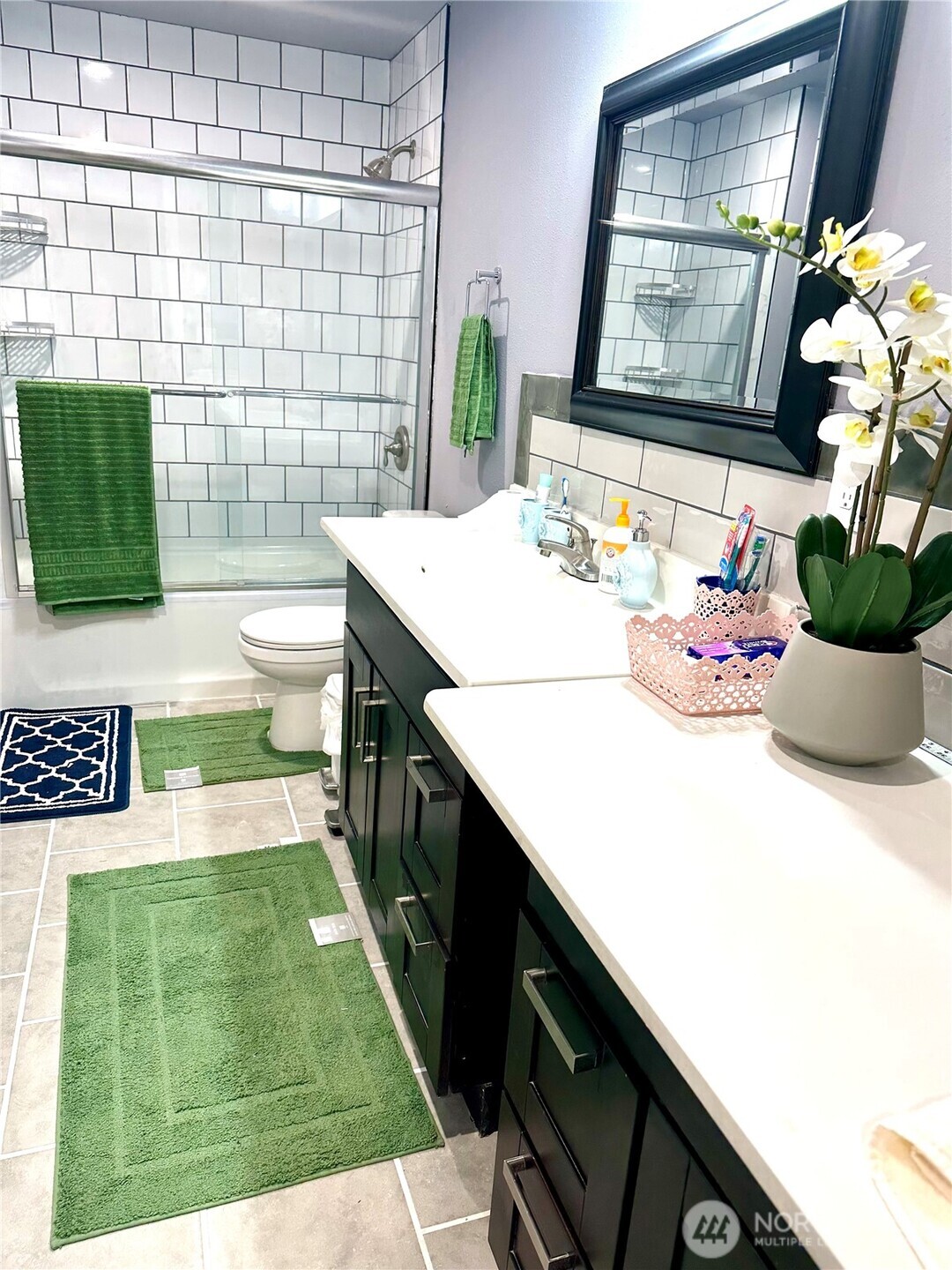 1302 Southwest Bay Street Port Orchard, WA 98366 - Photo 12 of 17 a bathroom with a sink a vanity and mirror
