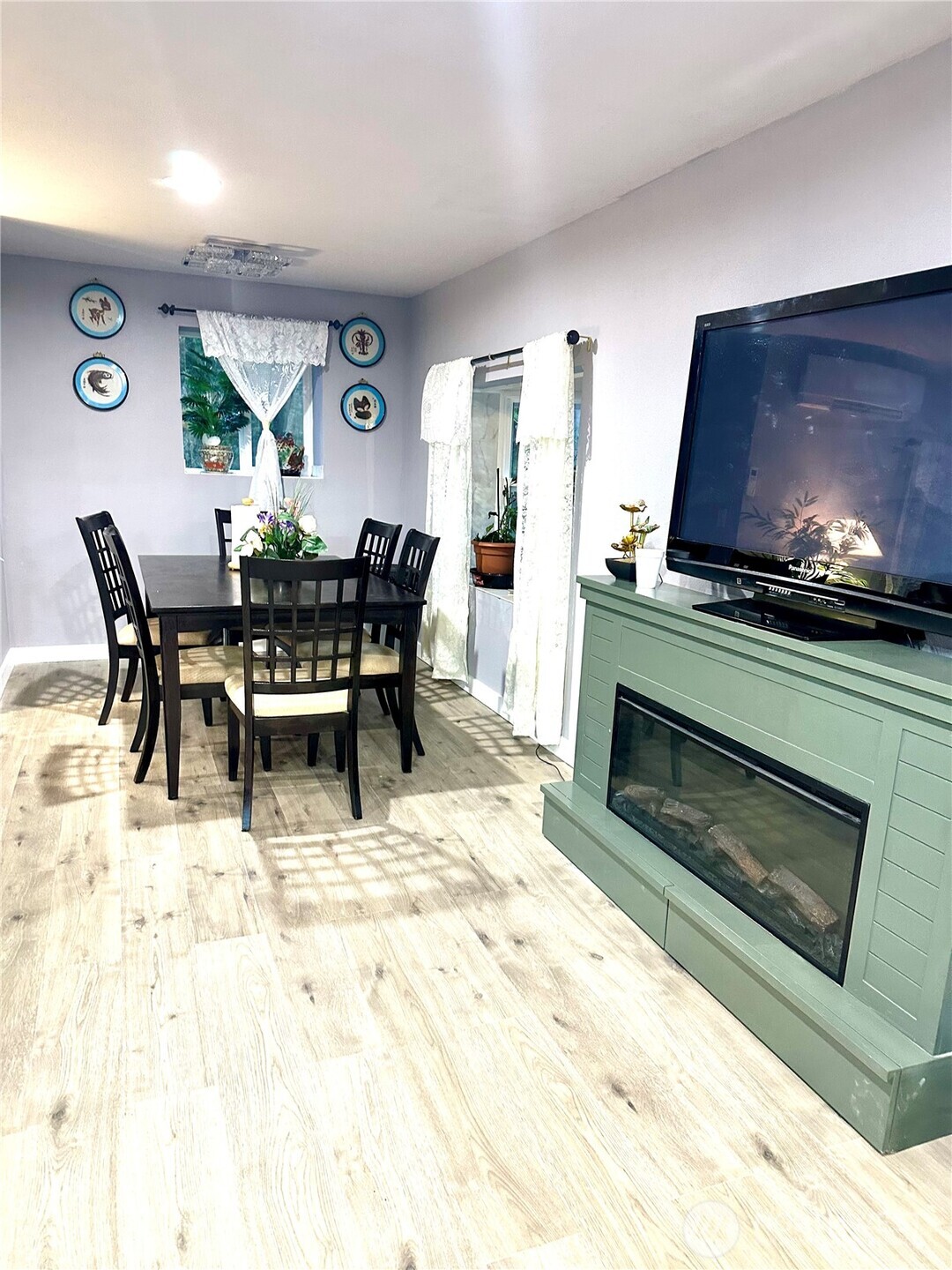 1302 Southwest Bay Street Port Orchard, WA 98366 - Photo 13 of 17 a view of a dining room with furniture and a fireplace